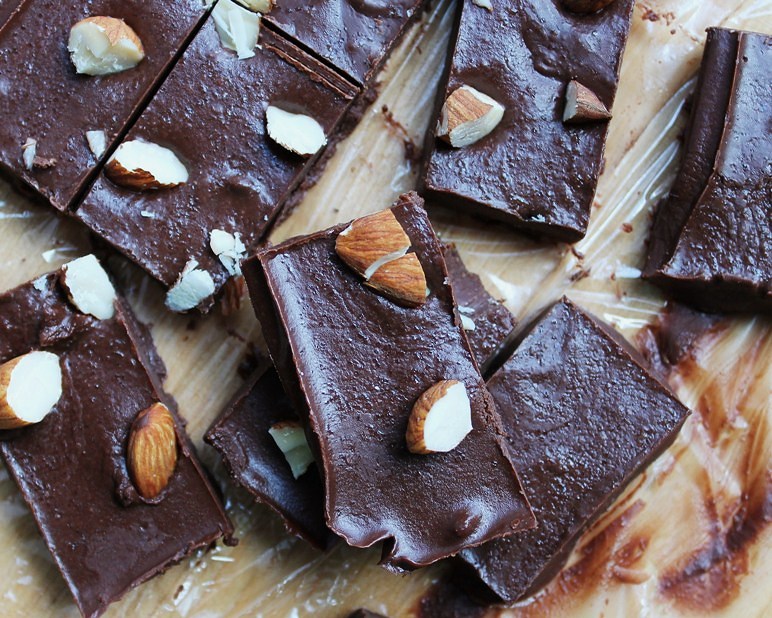 Several pieces of vegan fudge with almonds