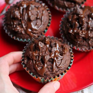 hand grabbing vegan double chocolate muffin