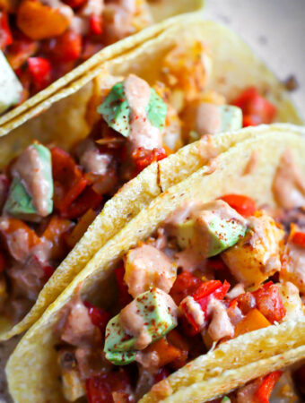 closeup of vegan Mexican potato tacos on platter