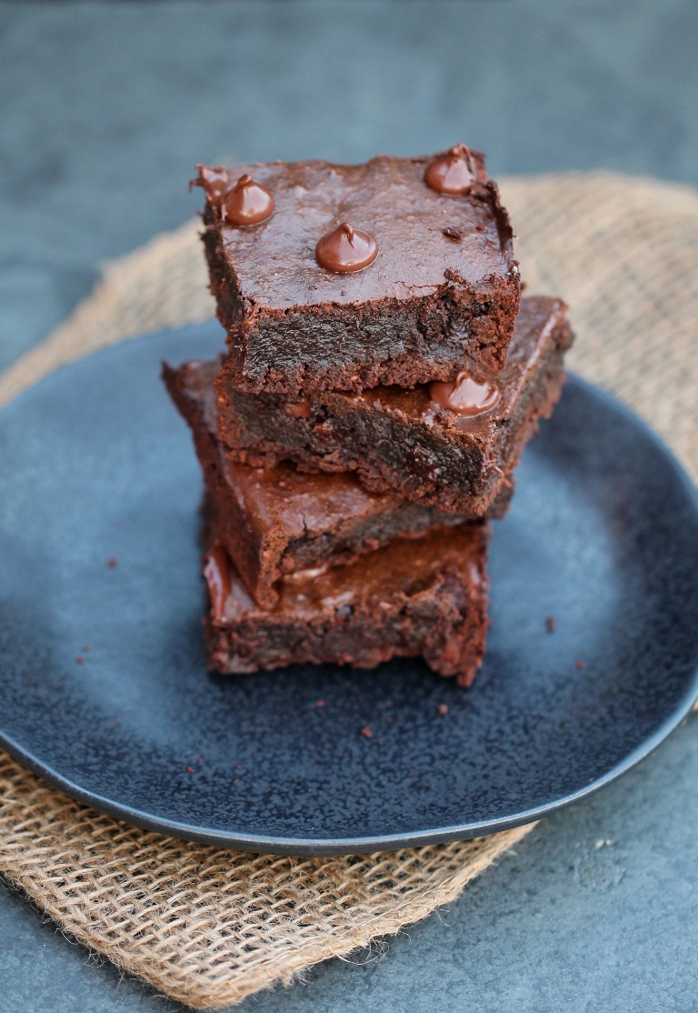 stack of brownies on round black plate