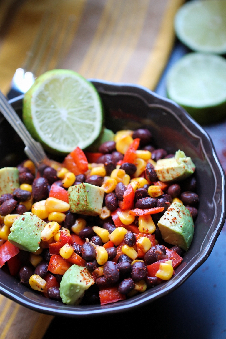 bowl of corn black beans avocado and lime dressing