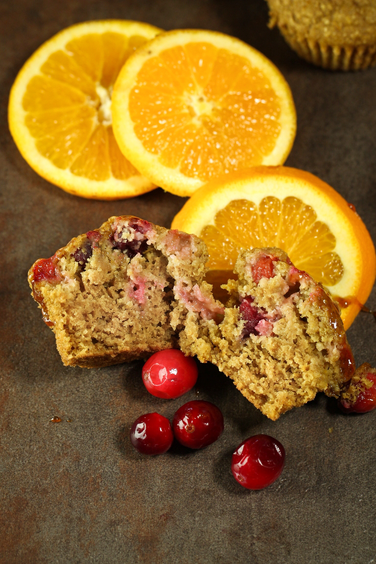 Inside view of vegan orange cranberry muffins with oranges