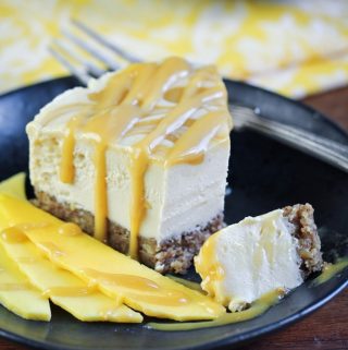slice of vegan mango caramel cheesecake on plate