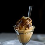 vegan pumpkin ice cream in glass bowl with spoon