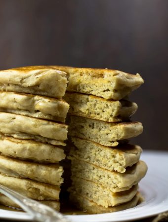 closeup of tall stack of vegan fluffy pancakes showing inside