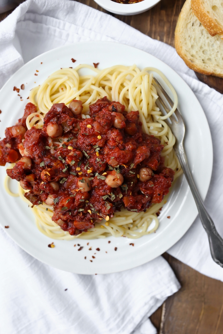 vegan chickpea tomato ragu sauce over spaghetti