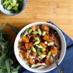 bowl of Jamaican stew over blue napkin