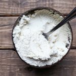 wood bowl of vegan ricotta cheese with spoon