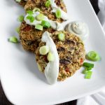 vegan crab cakes with aioli on white platter