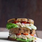 2 vegan caesar chickpea sandwiches stacked