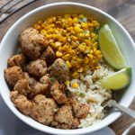 white bowl with Jamaican cauliflower corn and rice