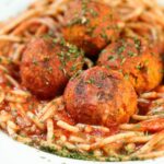closeup of vegan meatballs on spaghetti