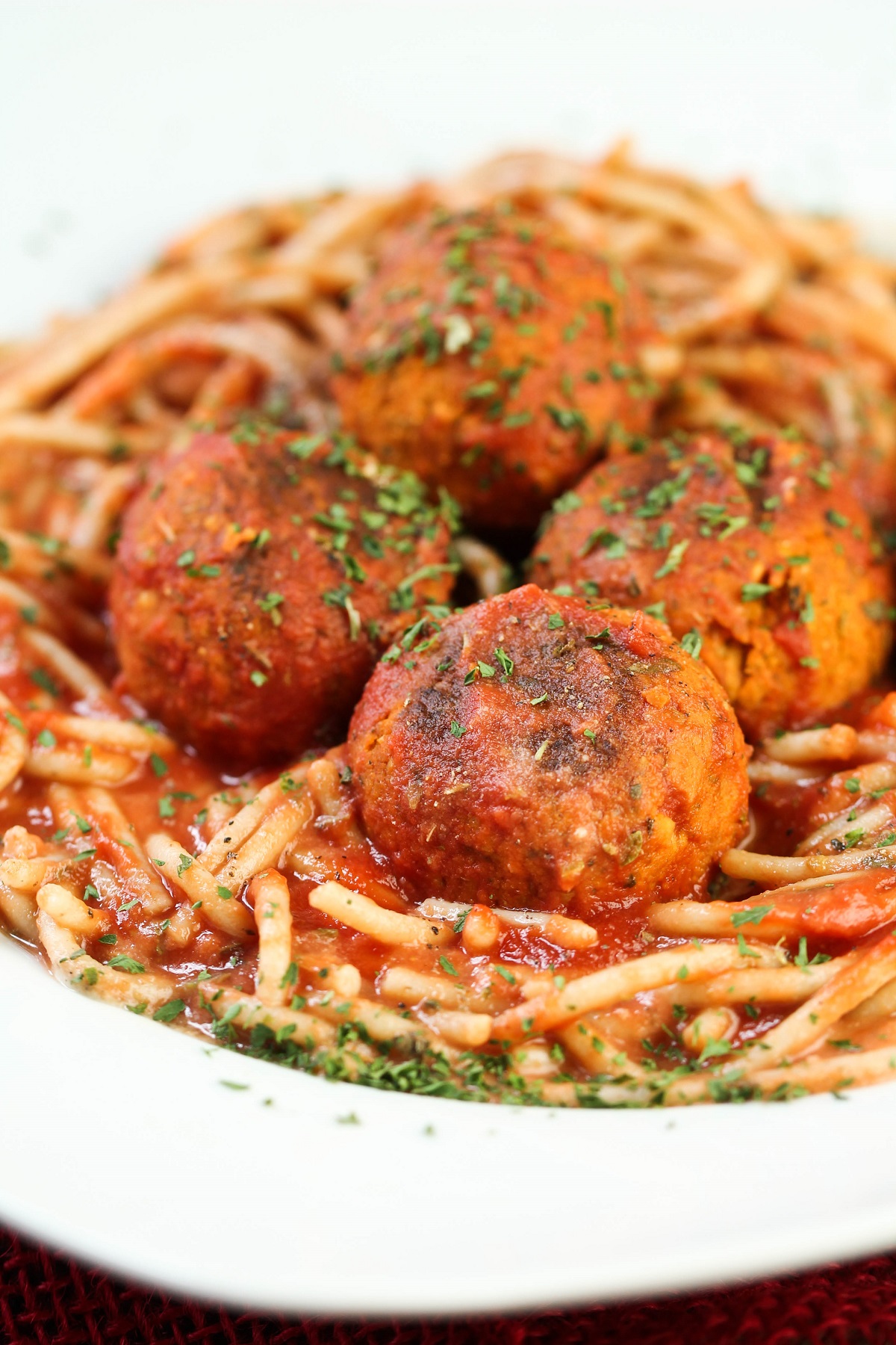 closeup of vegan meatballs on spaghetti 
