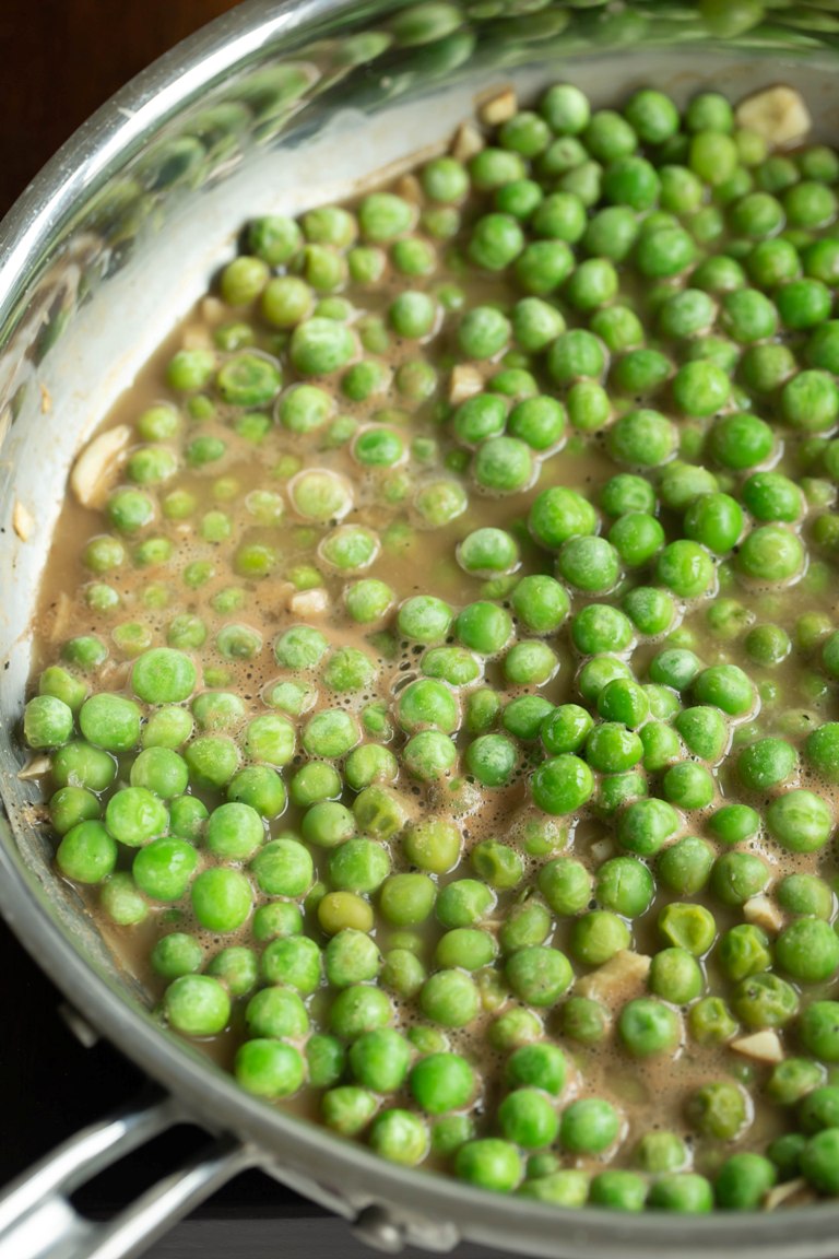 green peas cooking in pan