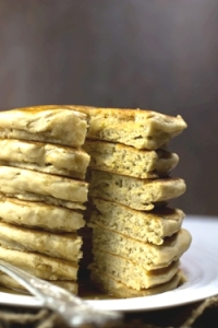 Fluffy vegan pancakes stacked on plate