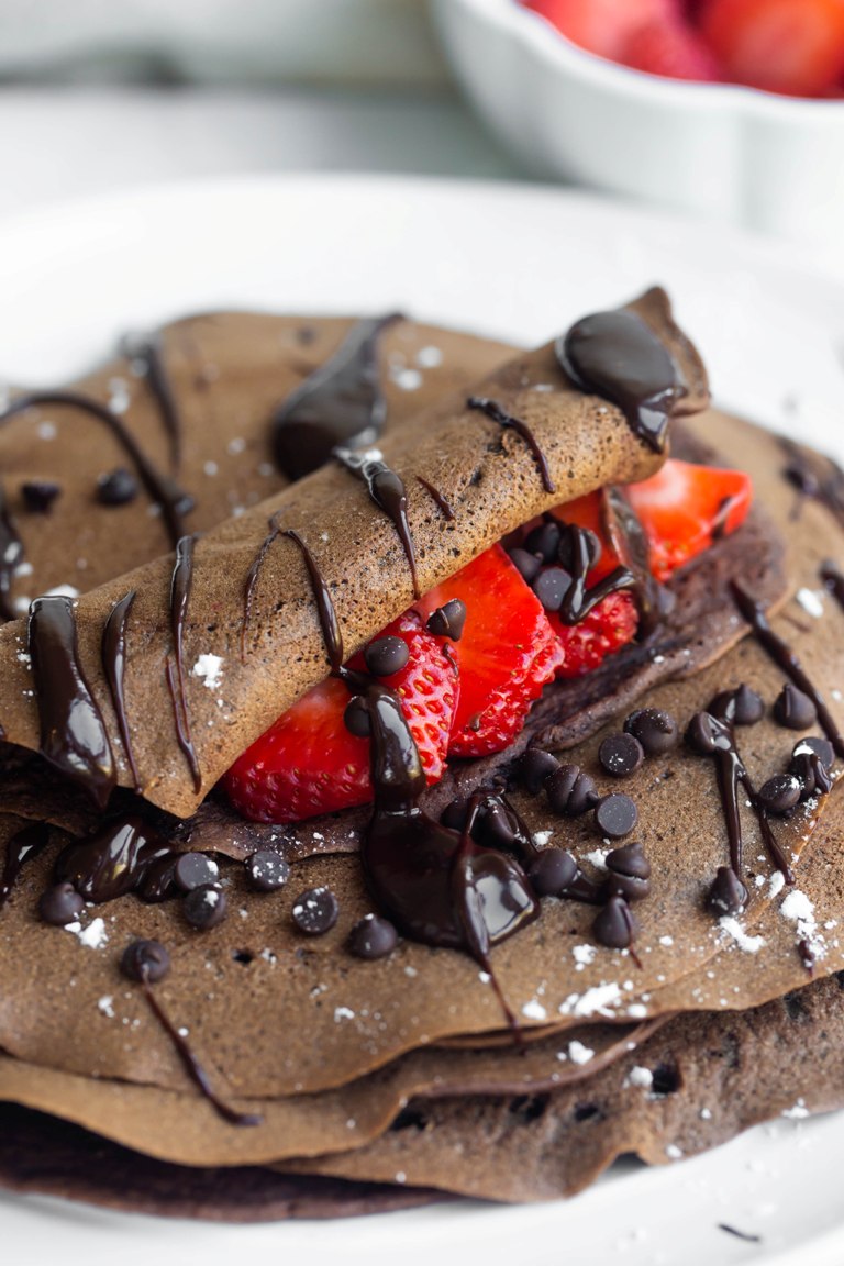 rolled up chocolate crepe with strawberries showing