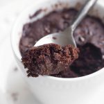 Spoon showing bite of vegan chocolate mug cake