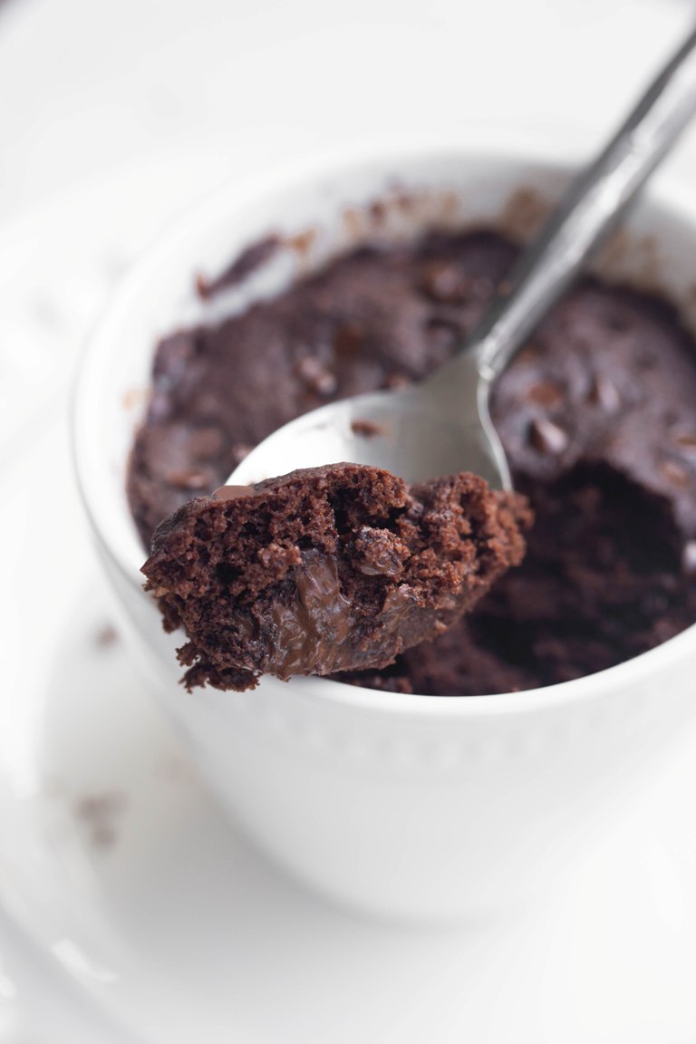 Spoon showing bite of vegan chocolate mug cake