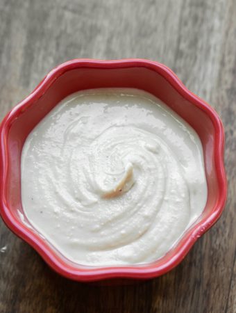 creamy smooth raw cashew butter in red bowl