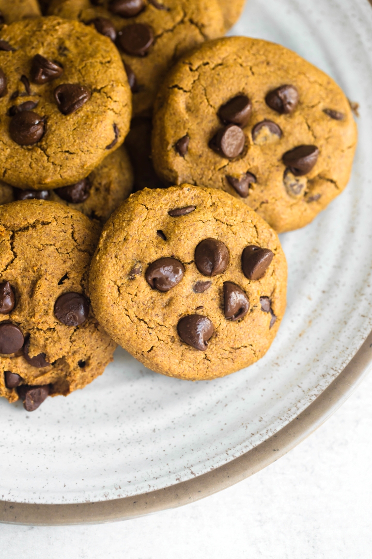 closeup of plate of vegan pumpkin chocolate chip cookies