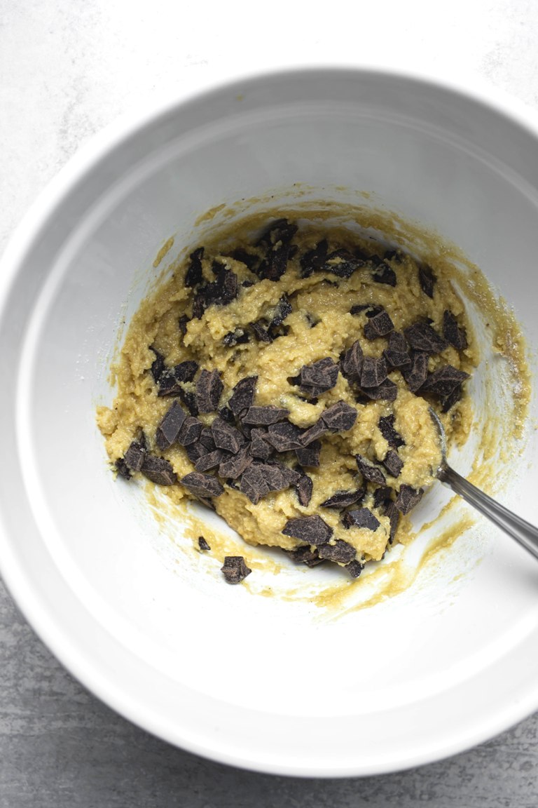 cashew butter cookie batter with chocolate chips in bowl