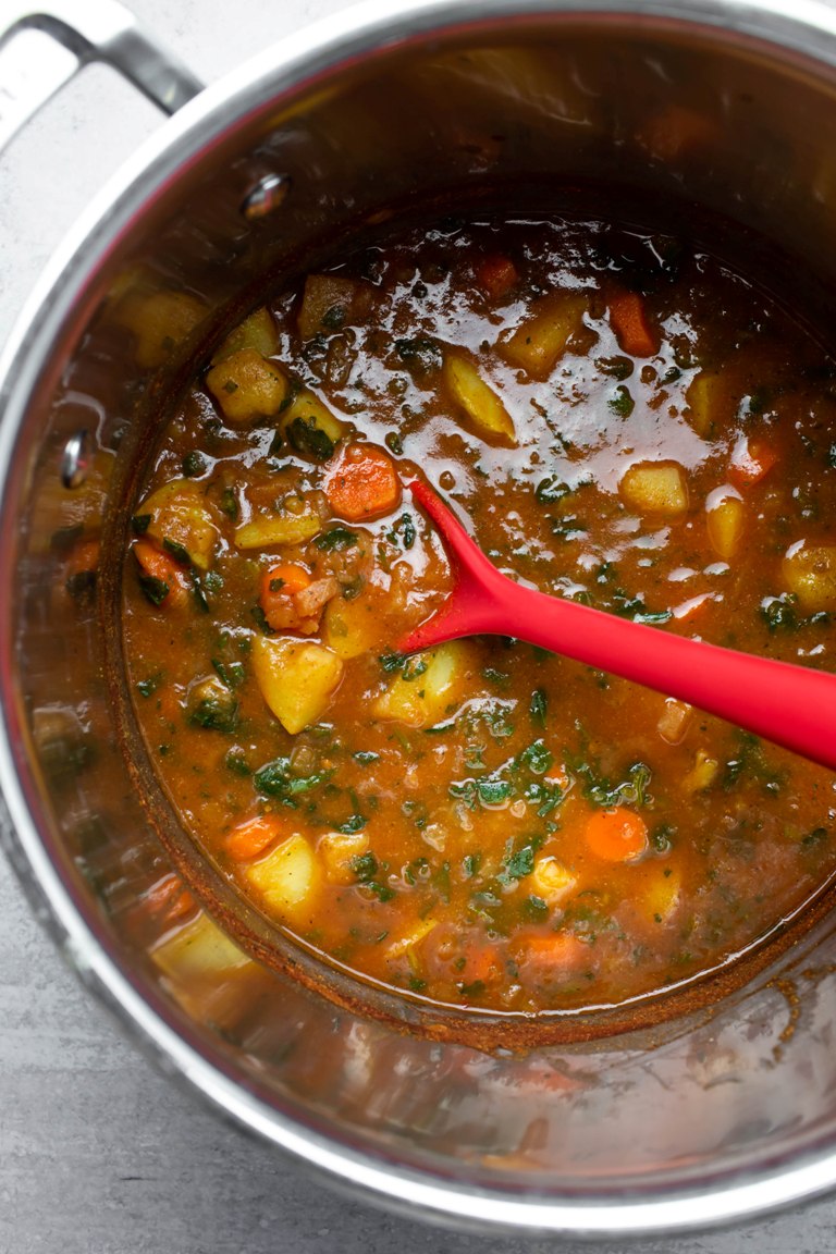 healthy potato carrot tomato soup in large pot