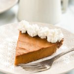 vegan pumpkin pie with whipped cream on top