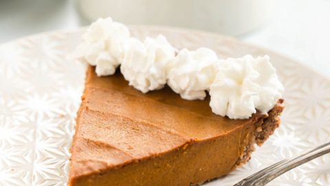 vegan pumpkin pie with whipped cream on top