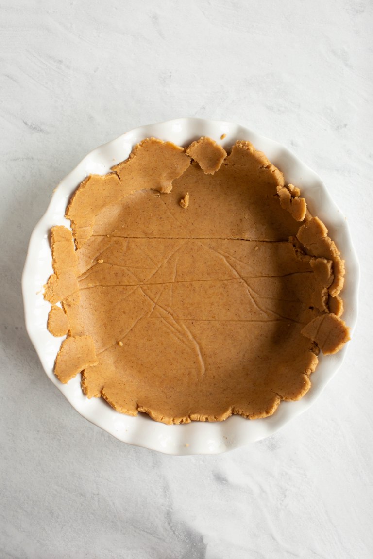 vegan pie dough in pie dish before baking