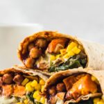 chickpea burritos stacked on top of each other on white plate