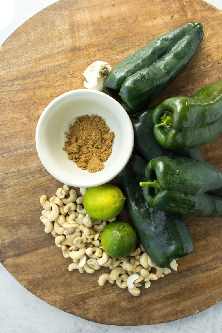 cumin cashews poblano peppers limes and garlic on wood board