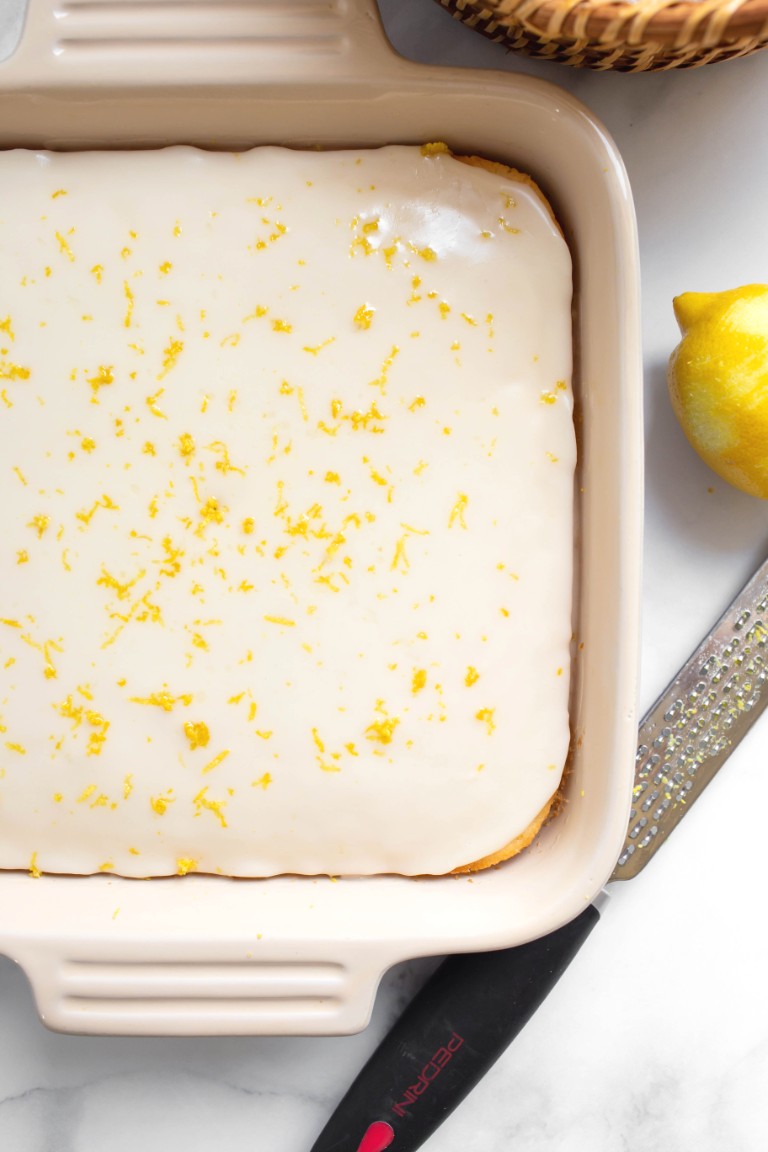 cake with lemon glaze and lemon zest on top