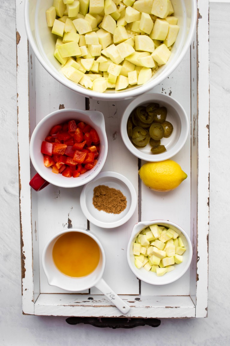 vegan creamy zucchini soup ingredients on white tray