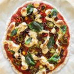 whole baked pizza with toppings and vegan mozzarella