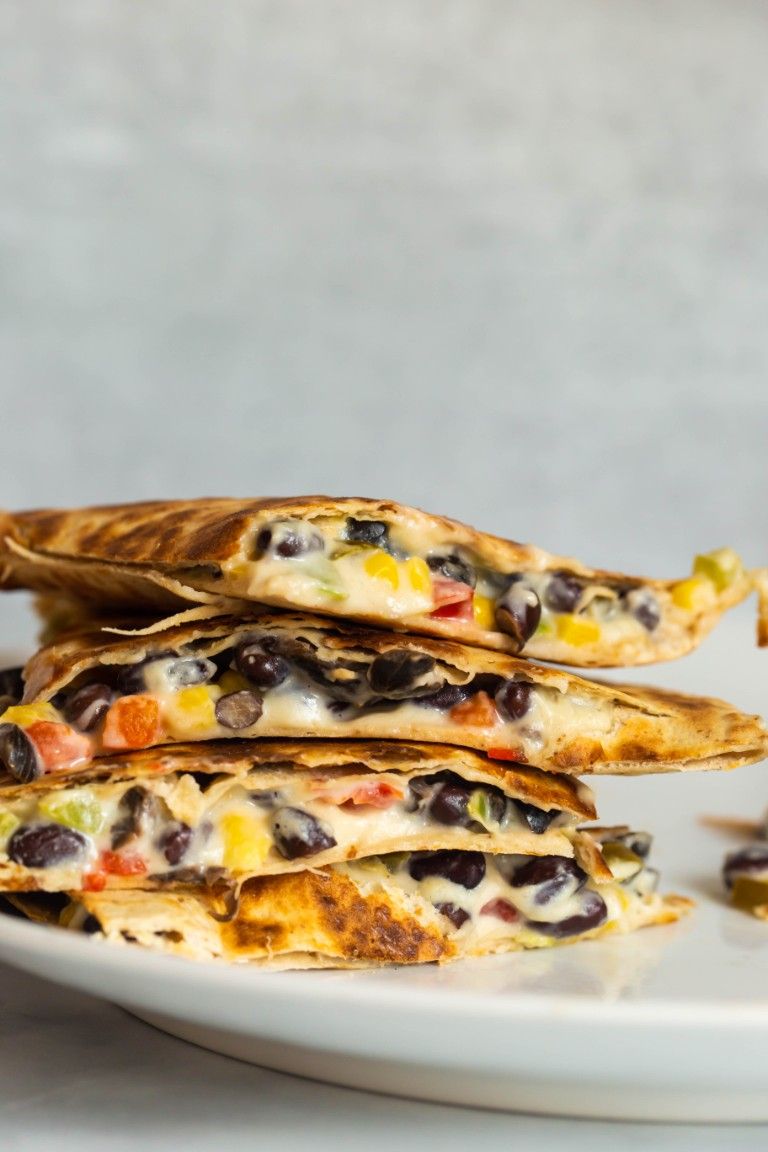 cheesy quesadillas stacked on top of each other