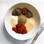 bowl of spice ingredients for Cajun seasoning