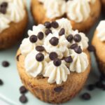 closeup shot of chocolate chip cupcake with frosting on top