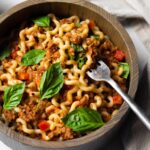 closeup of pasta with fresh basil