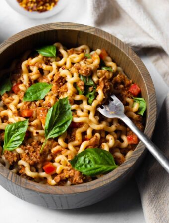 closeup of pasta with fresh basil