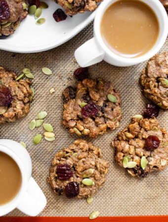 breakfast cookies with dried cherries on cookie sheet with coffee
