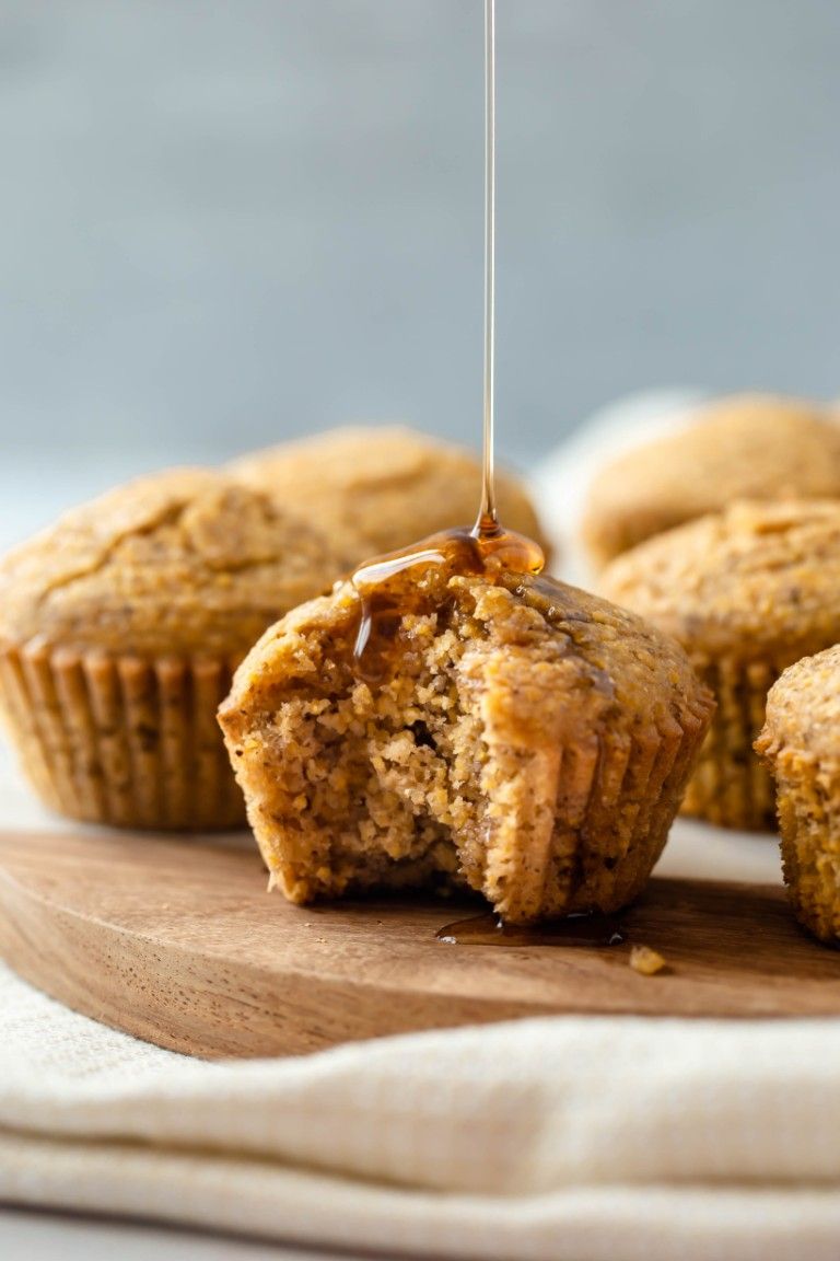syrup drizzling down vegan cornbread muffin
