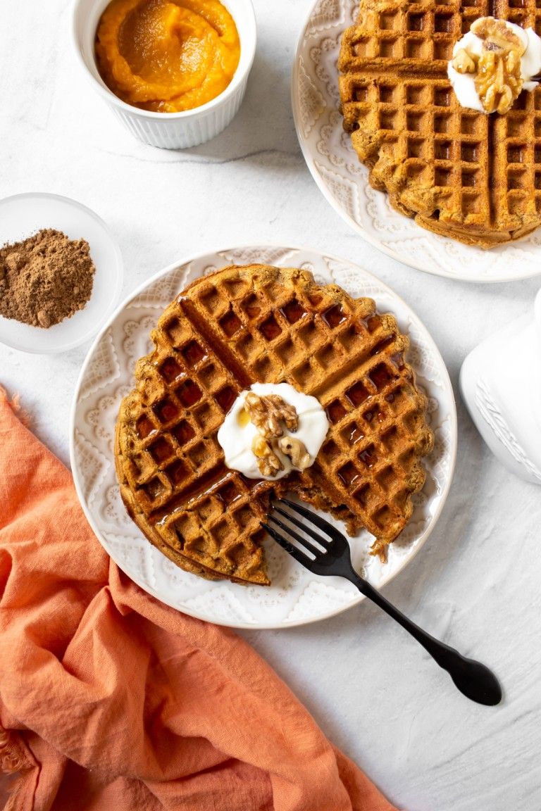 plate of waffles with dairy-free yogurt and syrup
