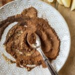 spices mixed together on white place with silver spoon