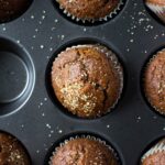 muffin pan of baked gingerbread muffins