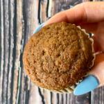 closeup of hand holding a biscoff muffin