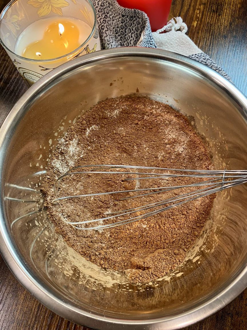 silver bowl with dry cake ingredients
