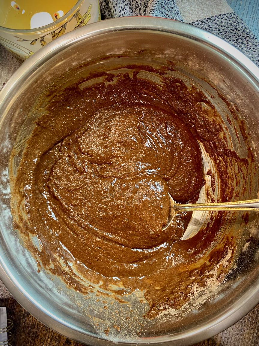 cake batter in silver bowl with spoon