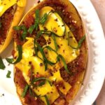 overhead shot spaghetti squash on white platter with toppings