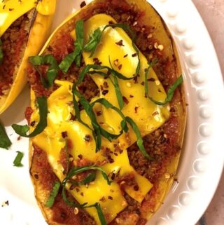 overhead shot spaghetti squash on white platter with toppings