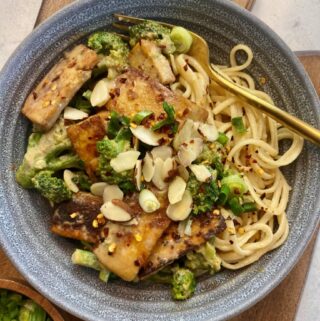 overhead shot of sesame noodles and tofu